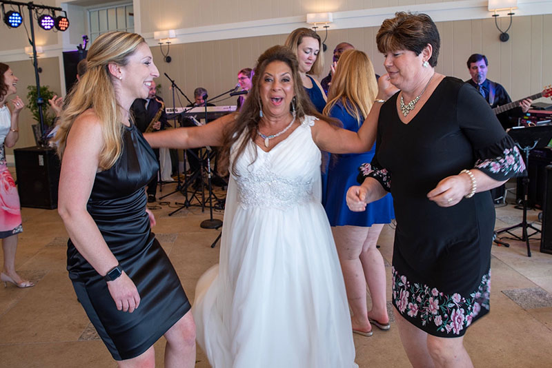 The bride and her friends dancing while Boston Premier performs.