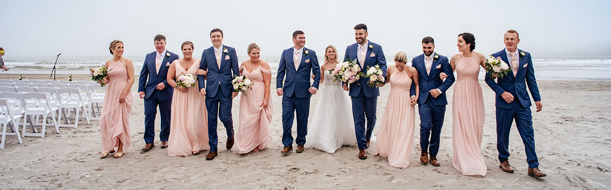 A bridal party walking together to listen to a Rhode Island wedding Band