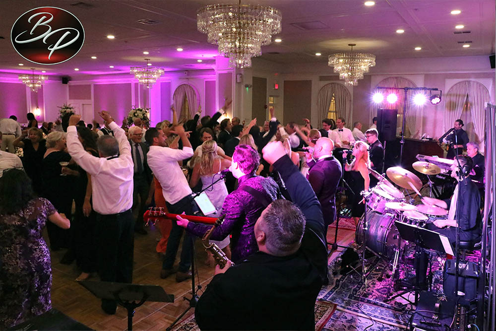 A packed dance floor at Madeline & James' wedding reception