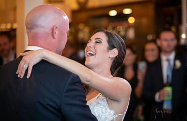 A couple enjoys their first dance while Boston Premier Band performed their special song.