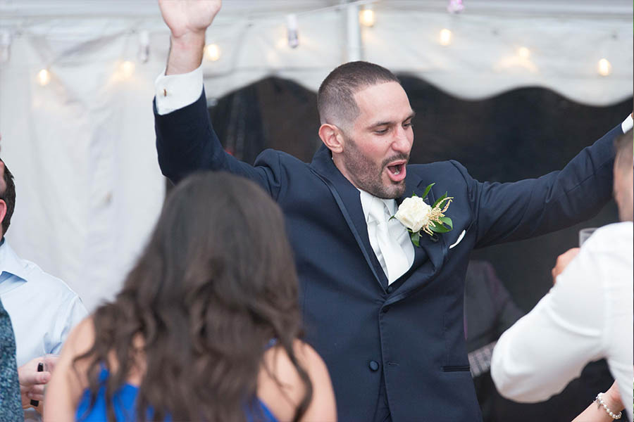 The groom having a great time dancing to the music of Boston Premier band.