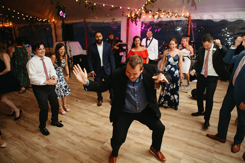 Wedding guests dancing wildly while Boston Premier plays a hot dance number.