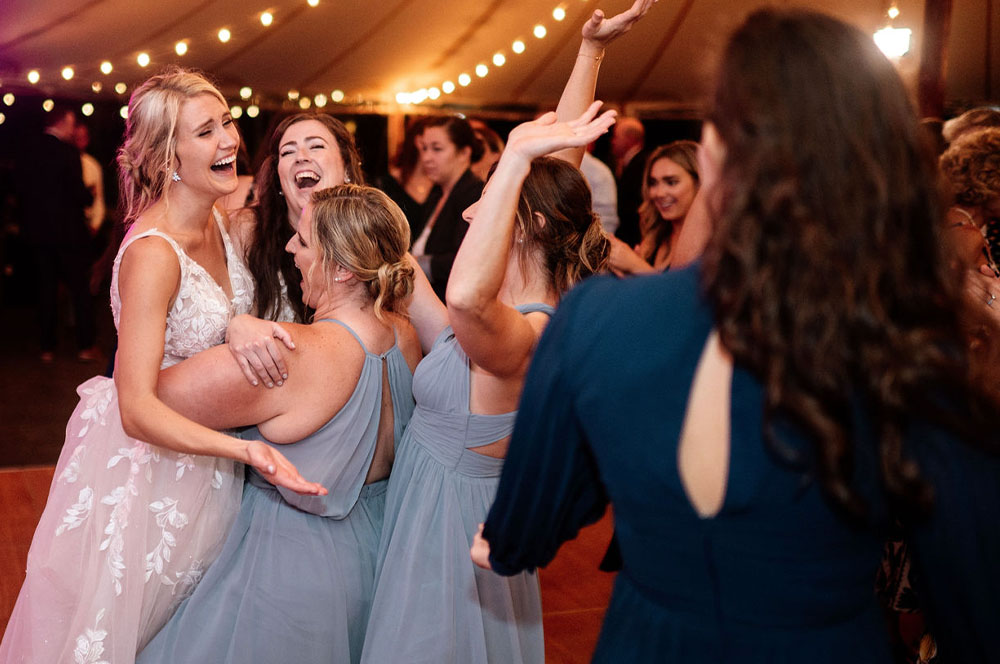 The brides dancing among friends as Boston Oremier wedding band plays great dance music.