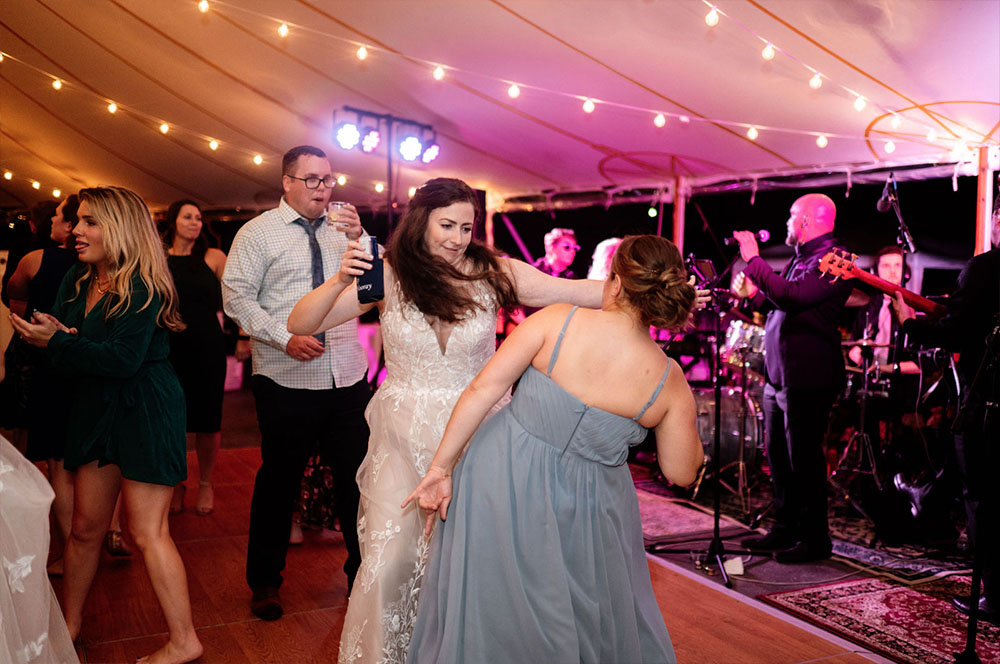 A bride dancing on the dance floor in front of a Boston wedding band