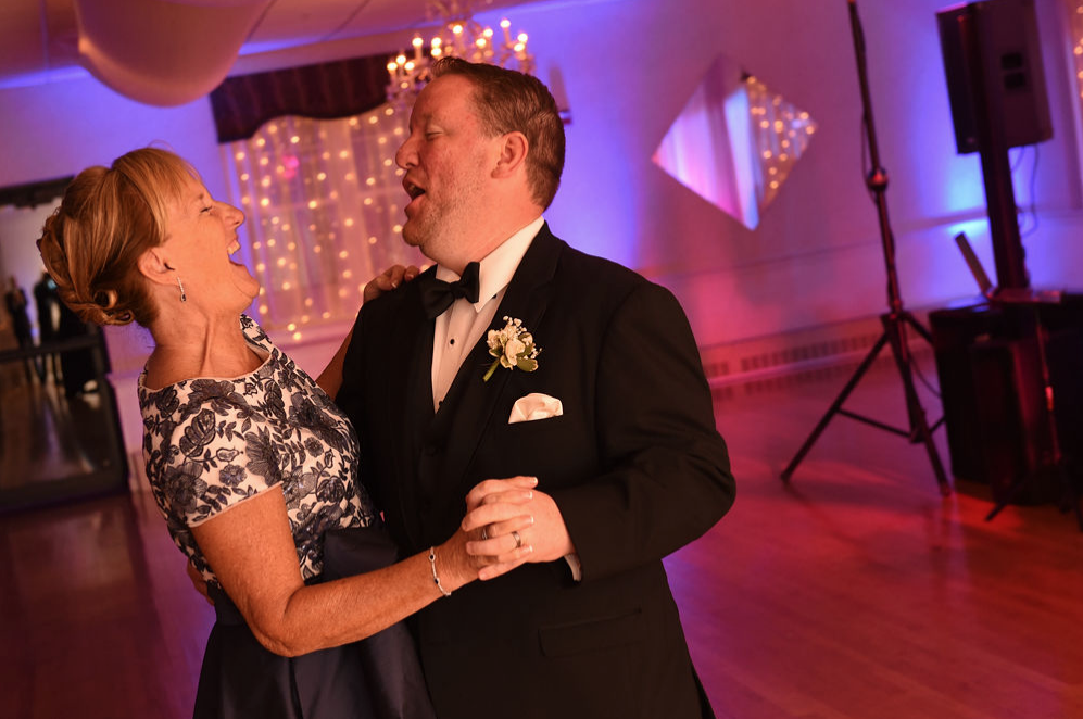 The groom Dances with his mother while the Boston Wedding band performs their song.