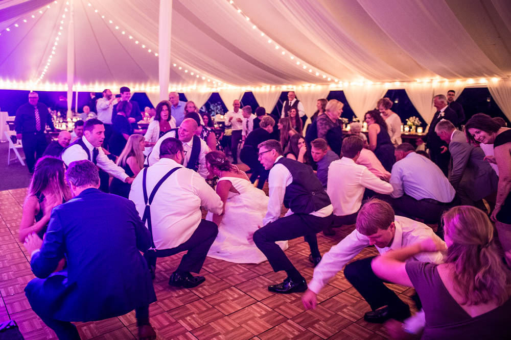 An active dance floor at a wedding while Boston Premier performs.