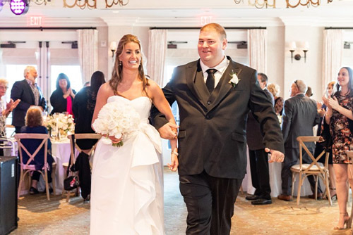 The Bride and groom making their grand entrance into the ballroom