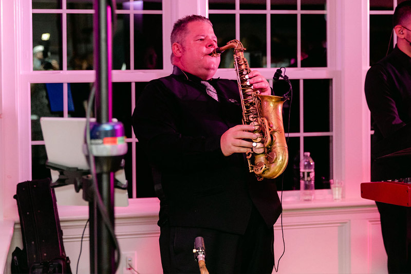 Boston Premier's saxophonist playing a solo at the wedding.