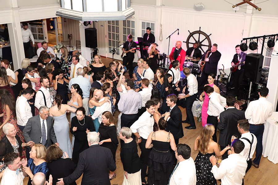 A wedding dance floor packed with dancers.
