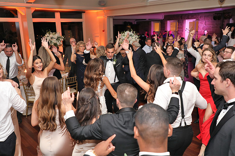 The Bride and groom surrounded bu their guests on the dance floor