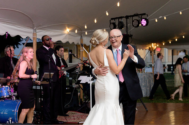The bride dances with her father during the wedding reception.