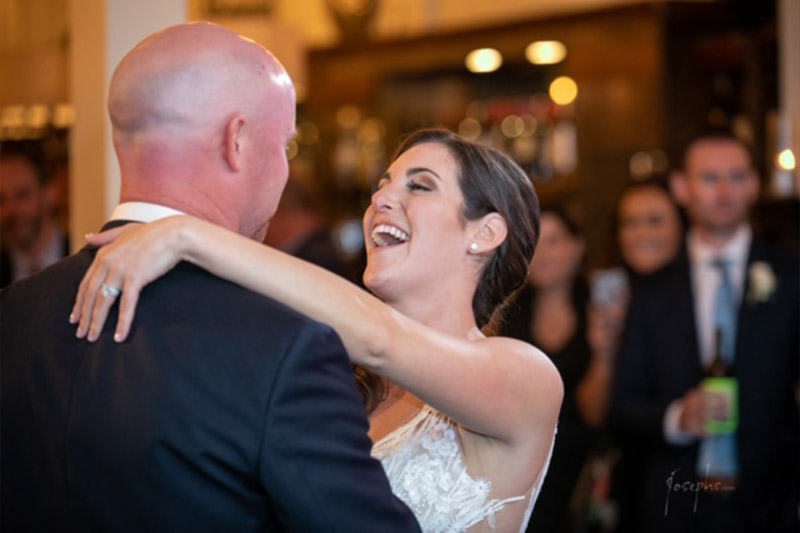 The bride and groom slow dance to a beautiful ballad performed by Boston Premier