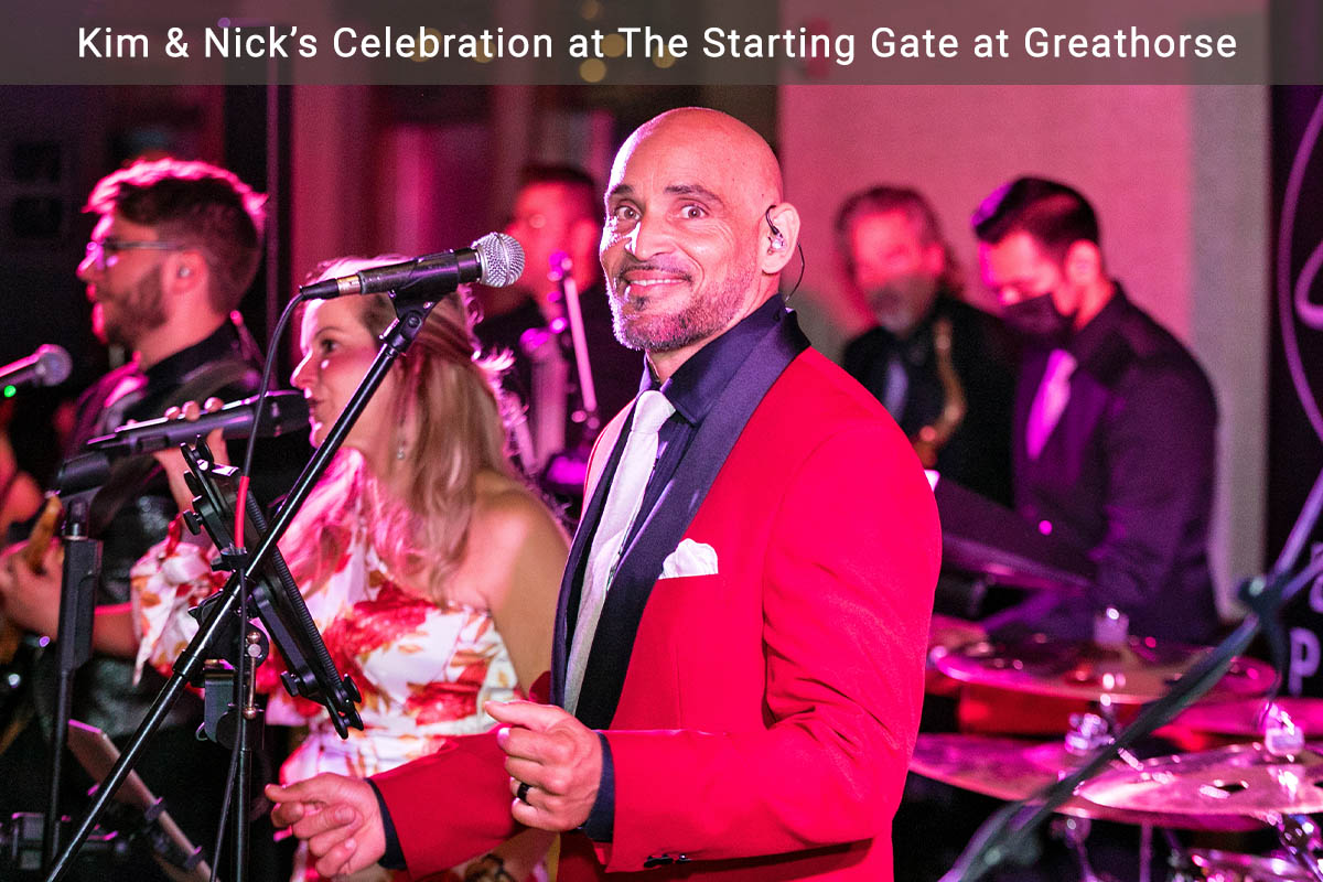 Boston Premier's lead vocalist smiles for a photo while he performs.
