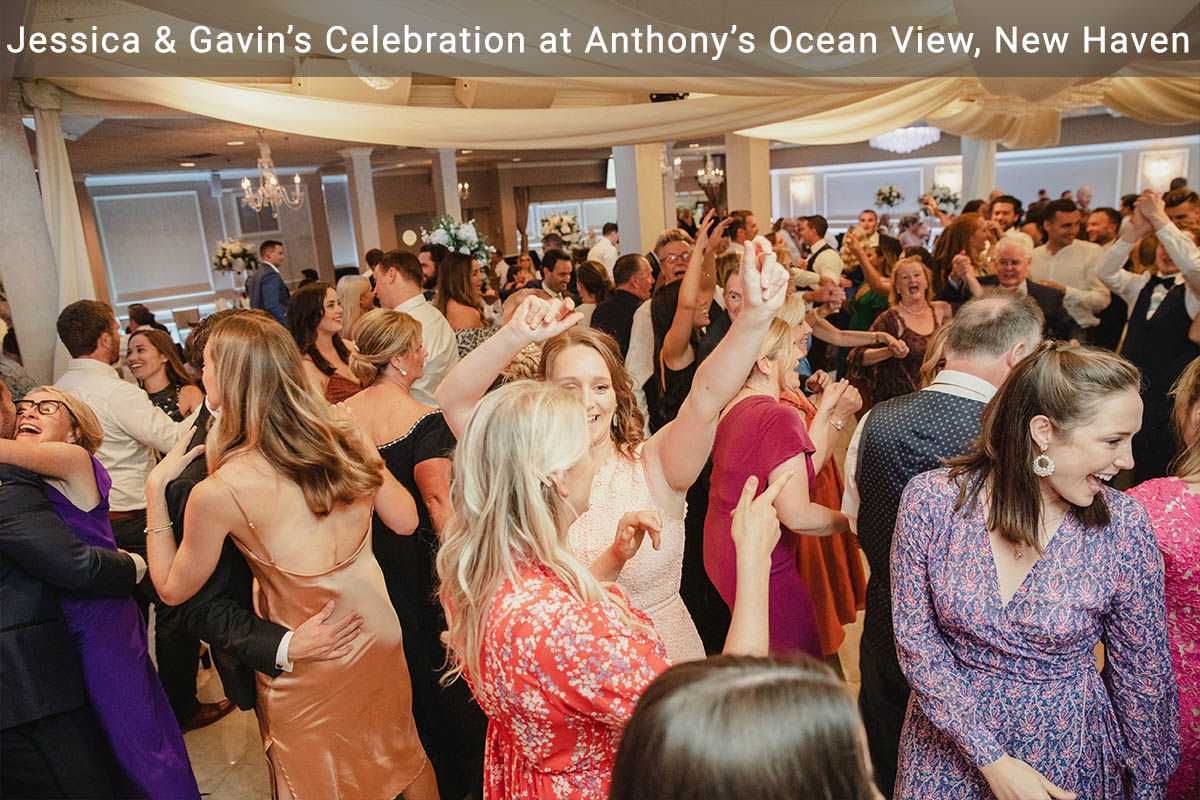 A crowd of people dancing at a wedding at Anthony's Ocean View