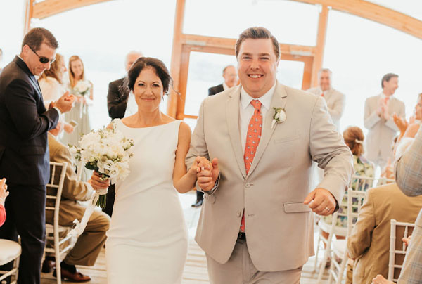 Will and Grace walking away from their wedding ceremony.