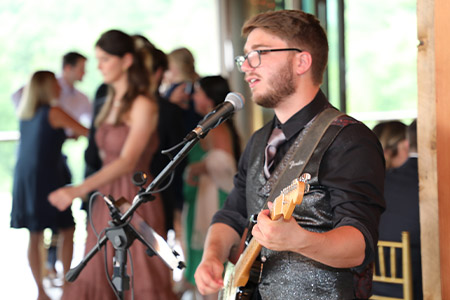 A solo guitarist performs at a cocktail hour at the Starting Gate in Hampden, Massachusetts