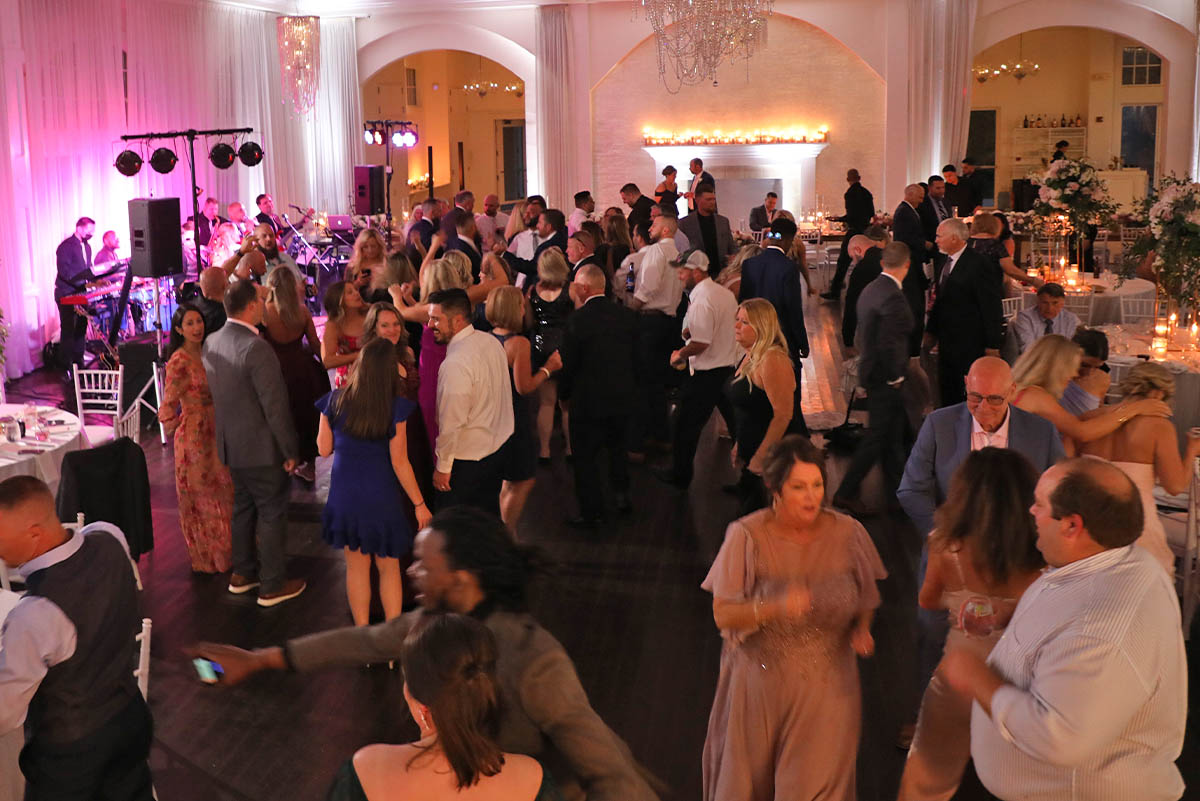 The wedding crowd rushes the dance floor as Boston Premier plays a great song.