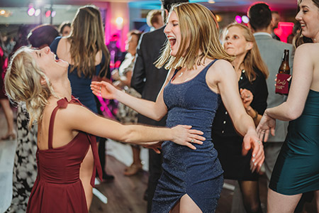 2 women dance to the music of Boston Premier at a wedding in Newport, RI