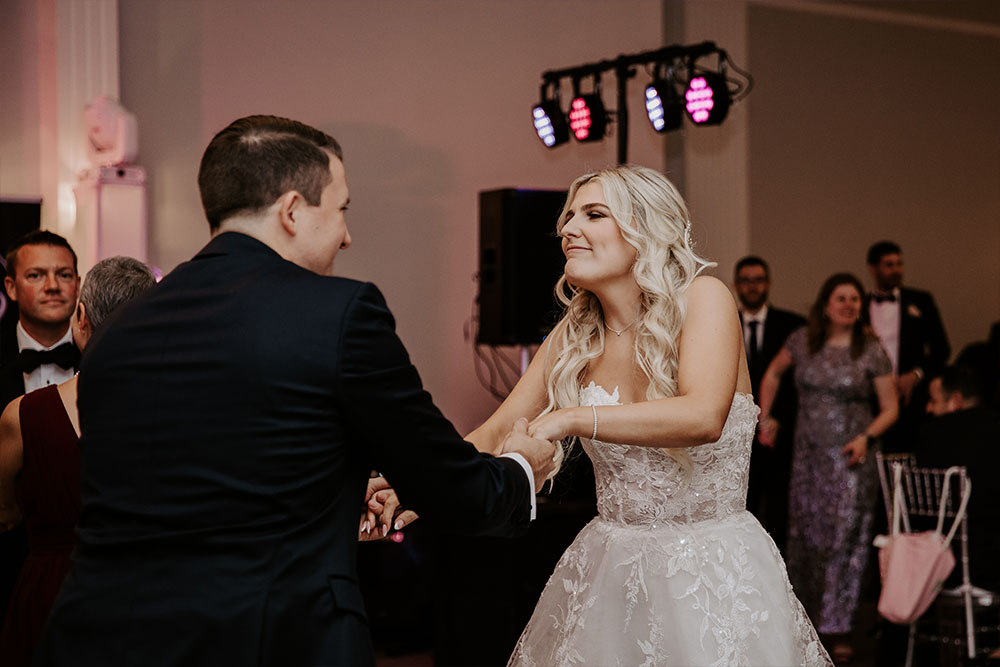 The Bride and groom dancing together while the band plays their favorite song of the night.