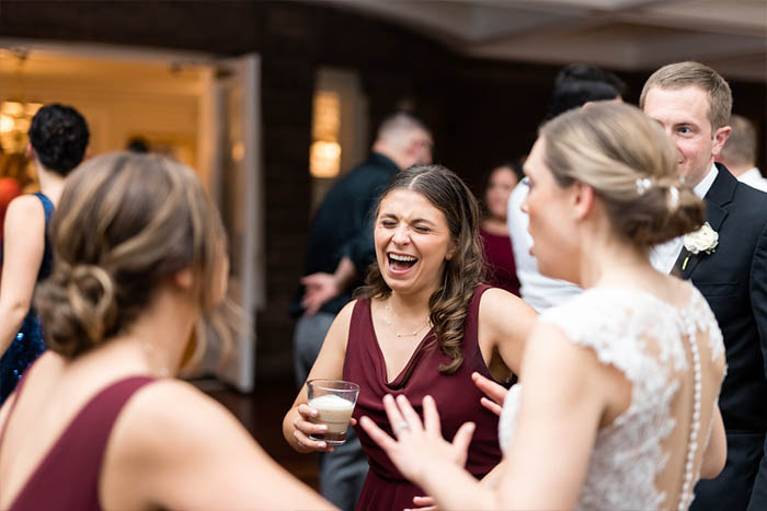 A bride and her friends dancing to the music of the Boston Premier band.