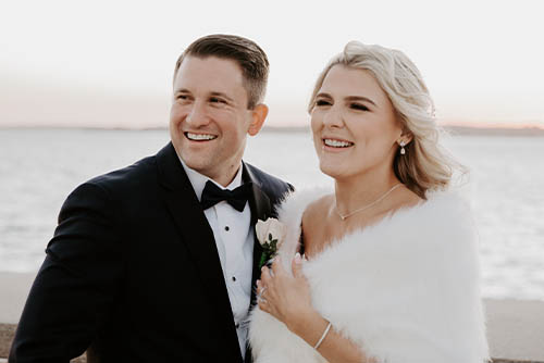 Peter and Alexandra pose for a photo on their wedding day.